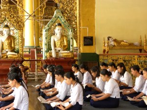 Burmese women reciting prayers in one of the many "tazaungs" or pavillions
