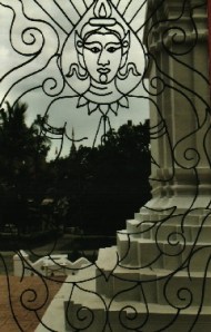 Rod iron Buddha Image window from Inside the viharn at Wat Suan Dok